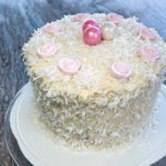 Layered coconut and raspberry cake recipe by home cooking with julie neville