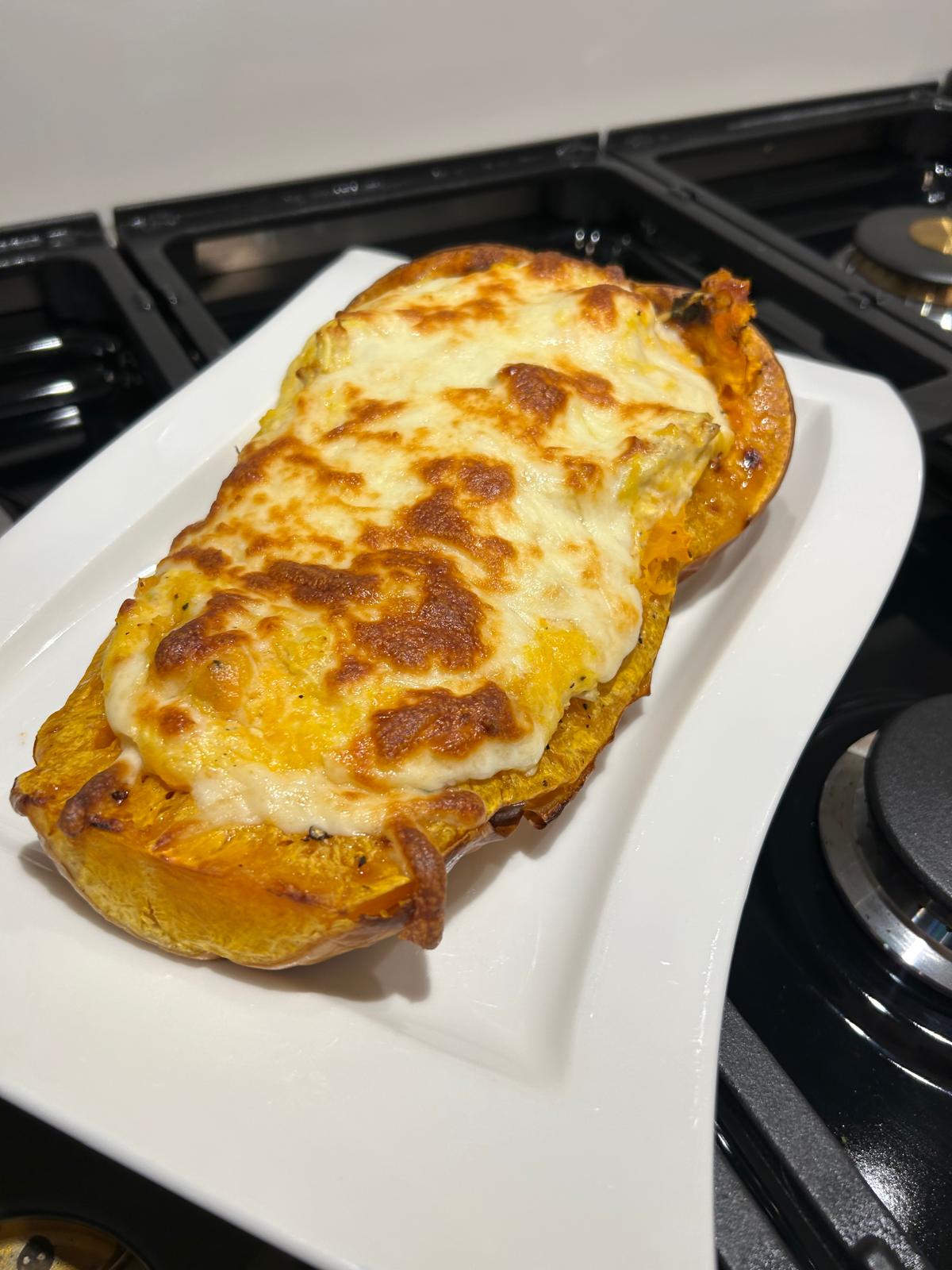 Baked Butternut Squash Topped with Chicken Alfredo