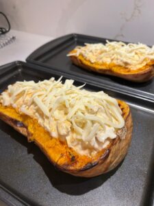 Baked Butternut Squash Topped with Chicken Alfredo