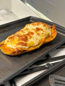Baked Butternut Squash Topped with Chicken Alfredo